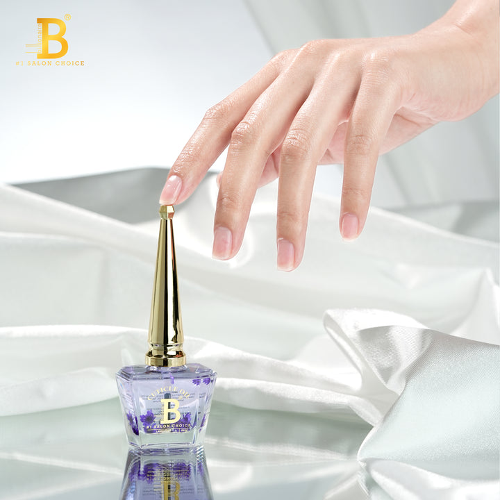 Billionaire Cuticle Oil Lavender bottle with manicured hand